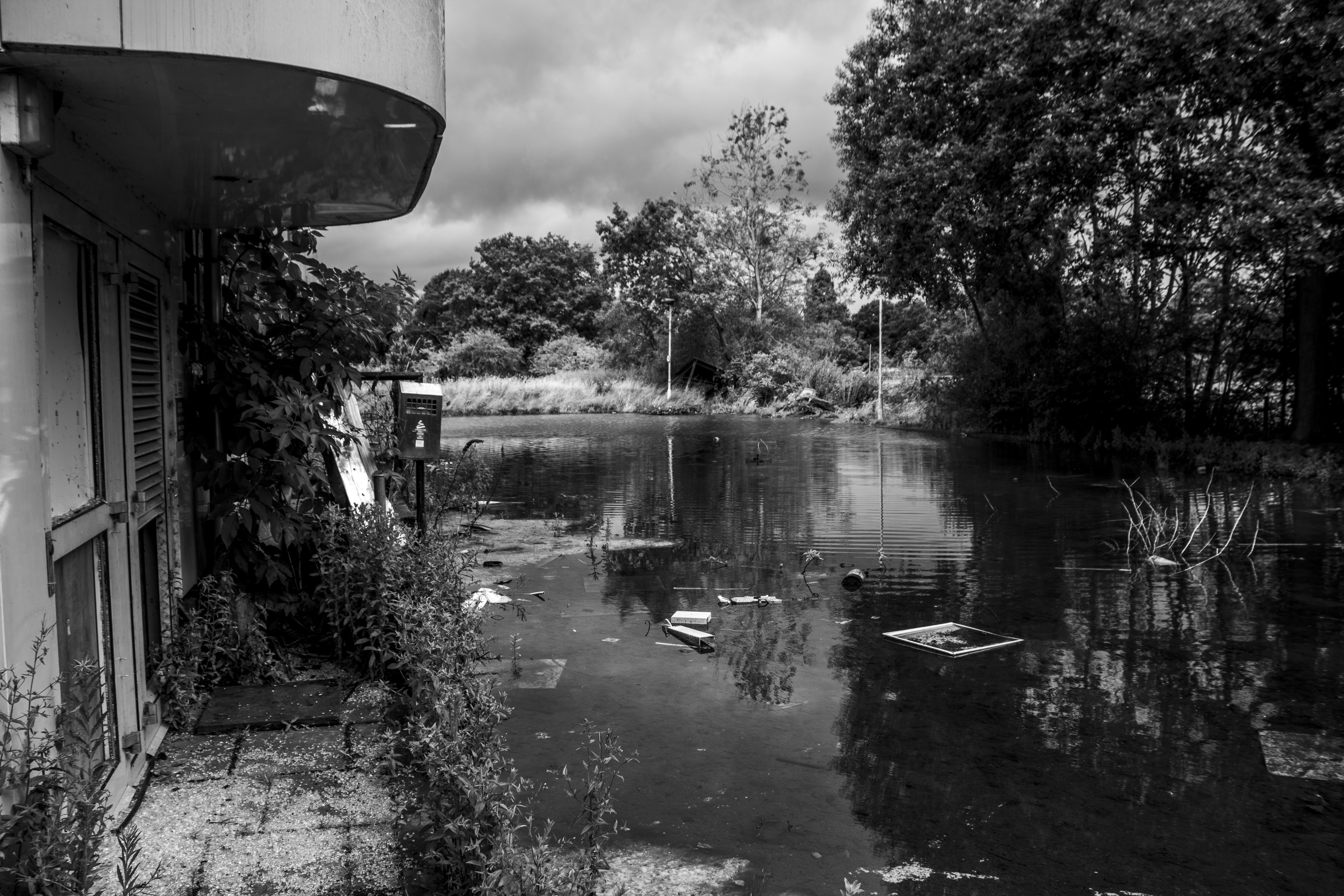 Flooded walkway with debris